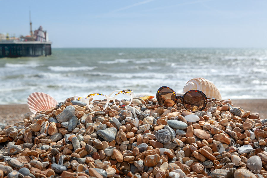 sunglasses on Brighton beach bebbles